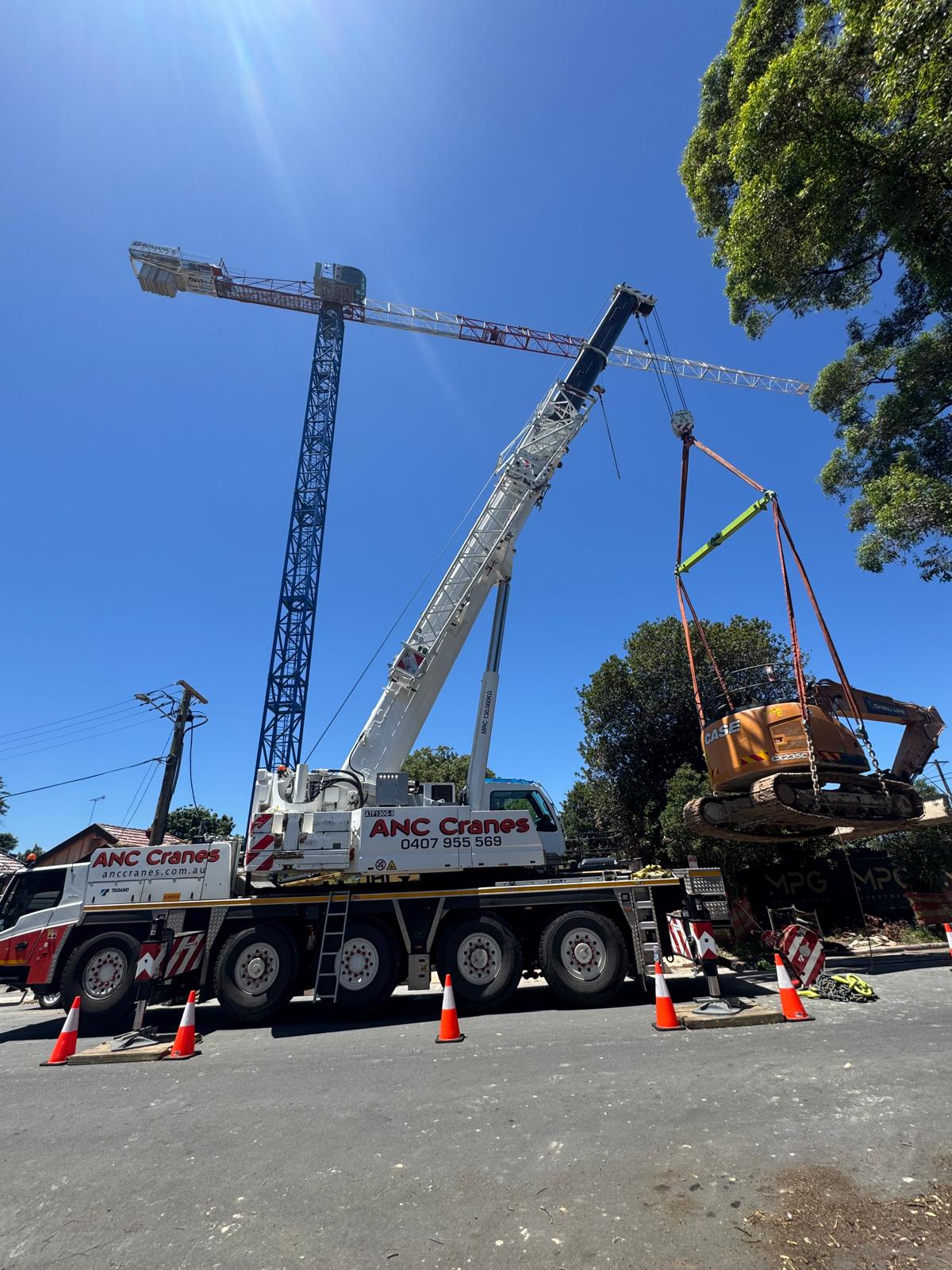 ANC Cranes lifting earthmoving equipment