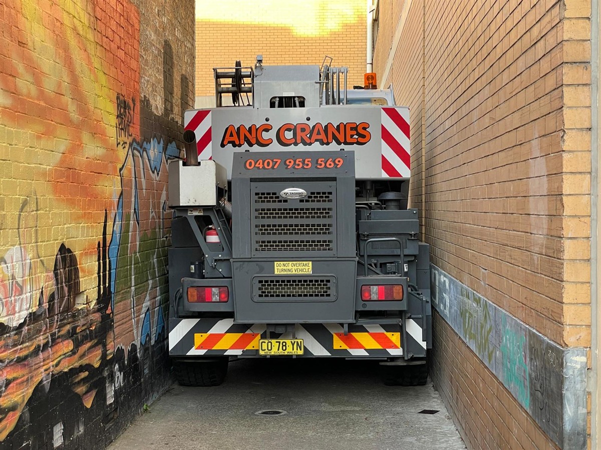 ANC Cranes city crane set up for a limited access lift